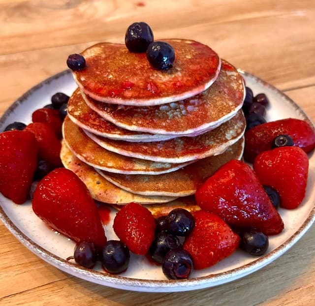 Delicious high-protein pancakes made with oats, eggs, banana, and protein powder—perfect for a nutritious, filling breakfast or post-workout meal.